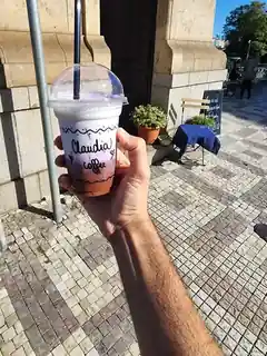 Purple Claudia Coffee drink outside the shop